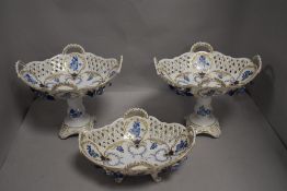 A selection of porcelain in a Meissen design two comports and a footed bowl having pierced sides