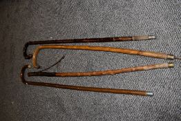 A selection of vintage walking canes/sticks.