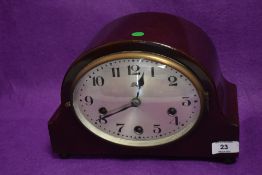 An art deco mantle clock with mahogany style case by Haller A.G