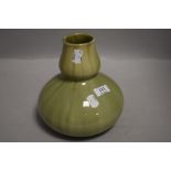 An art deco era studio pottery vase by Wescontree in gourd form with candy glaze