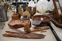 A mixed lot of treen including rustic carved candle sticks, bowl, two carved busts and more.