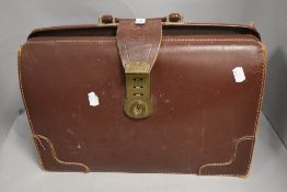 A 20th century leather briefcase or bag having burgundy finish made in England