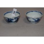 A pair of Chinese hard paste export tea bowl being hand decorated with fantasy landscape scenes