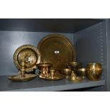 A selection of brass wares including Arabic or Islamic style chase work bowls