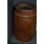 A large one piece carved wood bucket or grain bin
