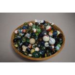 A selection of childrens toy marbles including lustre glazed, swirls and onion skin