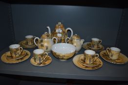 A Japanese part tea service being eggshell with hand decorated geisha scenes