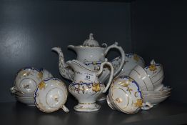 A Victorian part tea service possibly by Rockingham having gilt and cobalt decoration