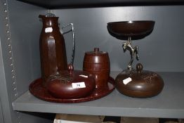 A selection of art deco bakelite items including a pair of containers, a barrel from jar and a