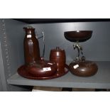 A selection of art deco bakelite items including a pair of containers, a barrel from jar and a