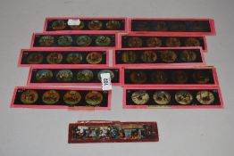 A selection of hand painted glass magic lantern slides