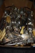 A large lot of mixed vintage and antique cutlery to include bone handled knives,strainers, nut