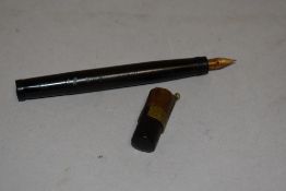 A Waterman ideal fountain pen with retracting nib in black with chased design with repair to cap.