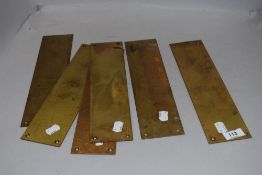 A set of six door furniture finger plates in brass