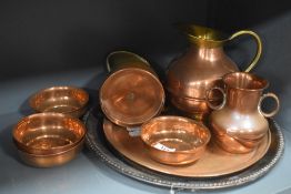 A selection of copper metal wares including Islamic style temple bowls