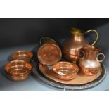 A selection of copper metal wares including Islamic style temple bowls