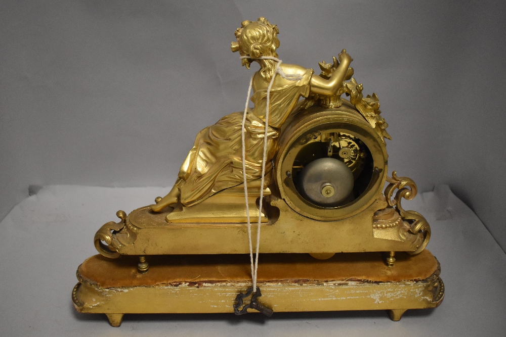 An 19th century French Empire garniture clock having ormolu case with porcelain panels and figure of - Image 2 of 3