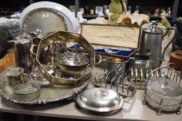 A large selection of plated ware including ornate footed tray,toast racks, unusual shaped water jugs