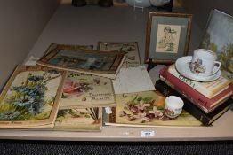 A mixed lot of Edwardian Painting albums,a German Childs cup and saucer and more.