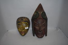 Two 20th century hand carved wooden ethnic tribal or ritual masks