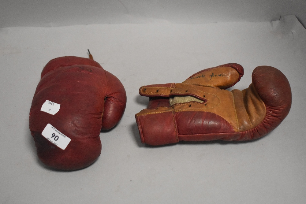 A pair of vintage leather boxing gloves