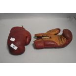 A pair of vintage leather boxing gloves