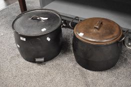 Two large cast iron farm house or country cottage stove pots including Kenrick both having lids