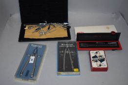 A collection of compasses and drawing instrument sets,some in boxes including Staedtler.