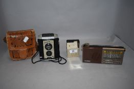 Two portable transistor radios including National and Mercedes with a Brownie camera