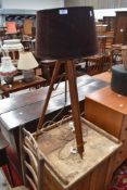 A vintage style standard lamp, having extendable frame, in the theodolite stand style, with