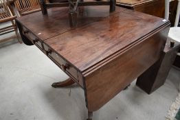 A 19th Century pedestal Pembroke table , in a Regency style , having drawer and dummy to each