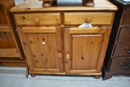 A modern pine side cabinet , having two drawers over cupboard, width approx. 90cm