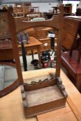 A Victorian stained frame hall mirror, with cubby base