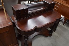 A Victorian mahogany dressing table, in the Dutchess style, lacking mirror and with damages