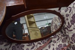 A modern mahogany wall mirror