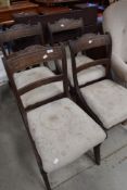 A set of four regency mahogany dining chairs, with carved tablet form top rails over a moulded mid