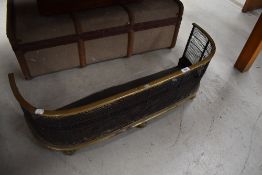 A Victorian brass and mesh fire fender