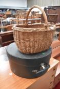 A traditional wicker basket and hat case