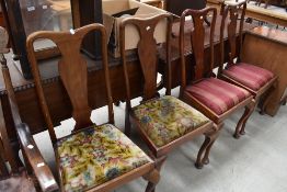 A set of four Queen Anne style vase back dining chairs