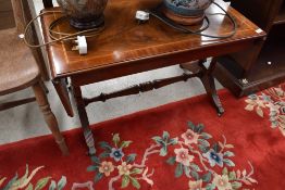 A reproduction Regency style yew wood coffee table