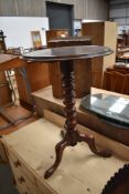 A 19th Century occasional wine table having circular top, turned column and triple splay legs,