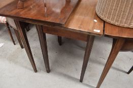 A 19th Century mahogany D end banquetting table having three centre leaves