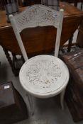 An over painted bentwood chair having art nouveau styling.