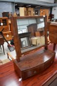 An early 20th century dressing table mirror having band fronted curved drawer base