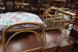 A bamboo magazine rack and similar stool