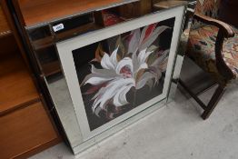 A floral print, after Sally Scaffold, in mirrored frame, slight chip to frame