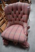 A deep buttoned easy chair of 19th century design