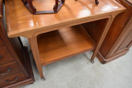 A vintage tea trolley of stylised form