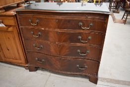 An early 20th Century reproduction Regency style mahogany chest having serpentine top, brushing
