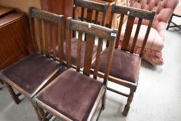 A set of four mid 20th Century stained frame dining chairs